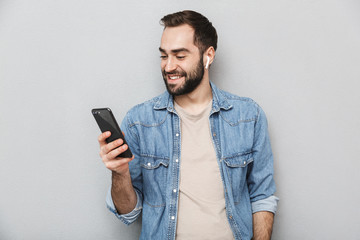 Sticker - Excited cheerful man wearing shirt standing isolated