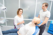 © Dmitry - pregnant woman and her husband communicate with a dentist in a medical office. Dental treatment for pregnant women