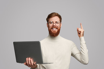 Ginger application developer pointing up