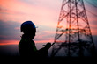 © reewungjunerr - Silhouette of asian engineer working on sunset,Thailand people work on sunset