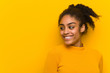 © Asier - Young black woman closeup over an orange wall