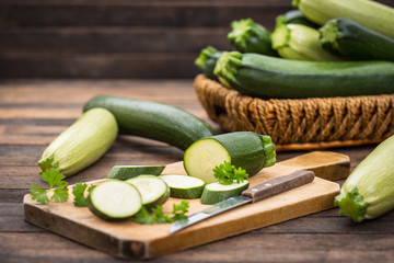 Wall Mural - Fresh organic zucchini on the wooden table