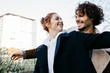 © Westend61 - Happy couple in the city facing each other