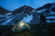 © Tandem Stock - A woman reads a Kindle (e-reader) by battery powered LED lantern in Upper Paintbrush Canyon in Grand Teton National Park at dusk.