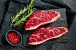 Steak of marbled beef black Angus. Black background, top view.
