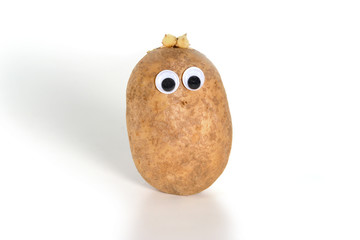 Googly eyes. Funny cute brown mister Fresh Potato, on white background.