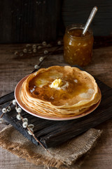 Homemade thin crepes, pancakes on wooden rustic background