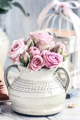 Wall Mural - Bouquet of pink roses in ceramic vase.