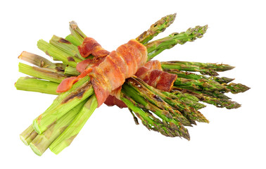 Wall Mural - Grilled asparagus wrapped in smoked streaky bacon rashers isolated on a white background