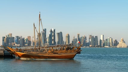 Wall Mural - Doha Qatar skyline with traditional Qatari Dhow boats in the harbor