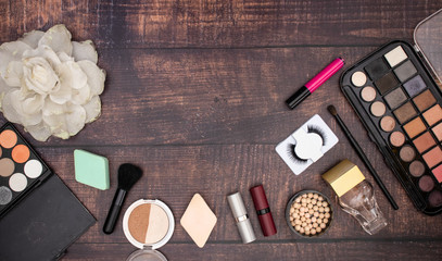 Make up beauty and cosmetics products for woman on wooden background 