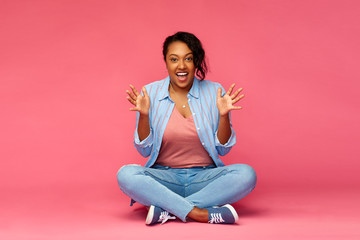 Sticker - emotions, expressions and people concept - happy excited african american woman sitting on floor over pink background