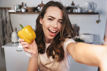 Attractive brunette woman wearing apron