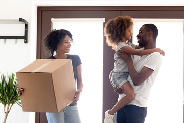 Wall Mural - Happy African American family moving in new own house