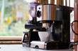 © Suprachai - white coffee cup and coffee maker machine