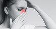 © Prostock-studio - Unhealthy woman in pain touching her head and nose