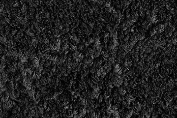 Texture of black carpet with long pile. Close up