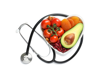 Wall Mural - Heart shaped bowl with healthy products and stethoscope on white background, top view