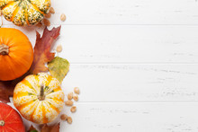 Autumn Backdrop With Pumpkins And Colorful Leaves