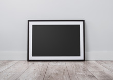 Blank Picture Frame On The Floor With Copy Space And Clipping Path For The Inside
