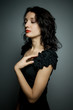 © Ольга  - Sexy brunette woman with red sensual lips posing on black background with closed eyes for pleasure