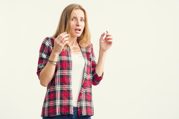 Wall Mural - Portrait of a frightened young woman. A woman shows emotions of fear, pain, disgust.