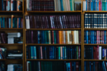 Background For Wallpaper In The Form Of A Defocused Bookshelf.