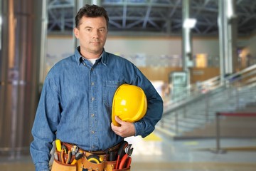 Canvas Print - Male worker with tool belt isolated on white  background