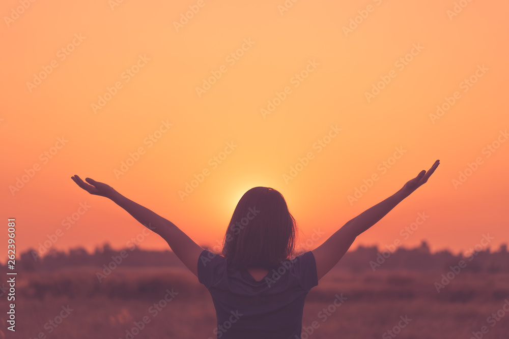 Freedom feel good and summer vacation adventure concept. Copy space of woman raise hand up standing at rice field and morning sky abstract background. - obrazy, fototapety, plakaty 