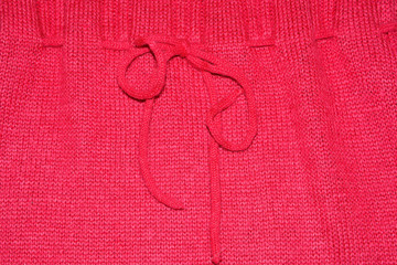 The texture of the knitted red fabric for the background 