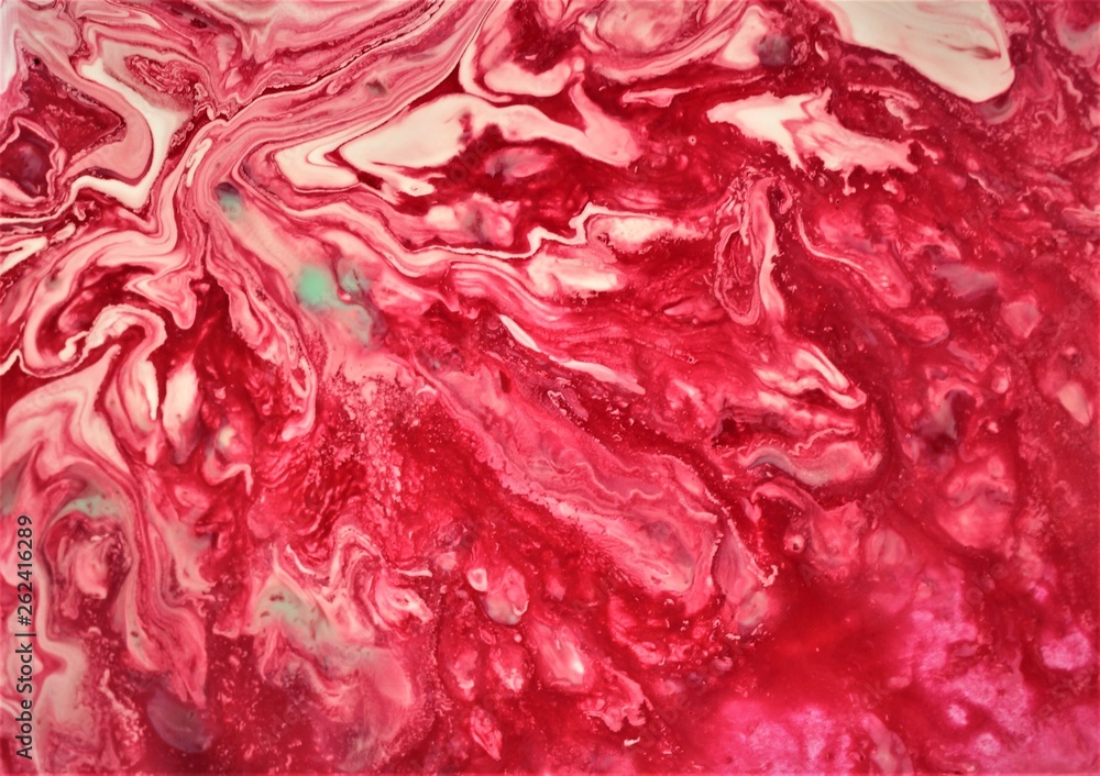 Red paint freely mixed with white. Abstract artistic texture. Acrylic paint and liquid inks are mixed in the water. Color and its transitions create an interesting structure. Red paint freely mixed wi
