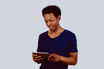 Afro American man with digital tablet.