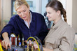 © auremar - two women in uniforms and job in factory