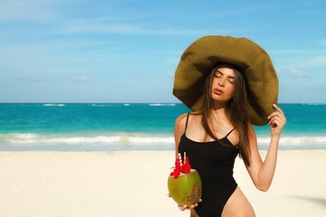 Wall Mural - Girl on the beach. Summer holiday idyllic.