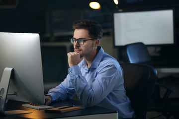 Male programmer working in office