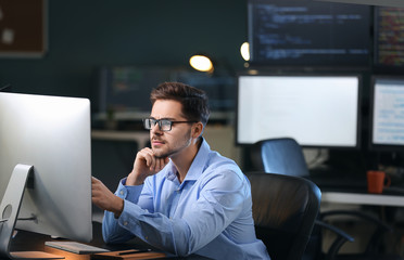 Male programmer working in office