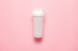 White plastic sports shaker on pastel pink  background.  Trendy athletics and sport minimal  concept. Female fitness.Flat lay, top view. 