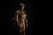 © kaninstudio - Special forces United States soldier or private military contractor holding rifle. Image on a black background. war, army and people concept