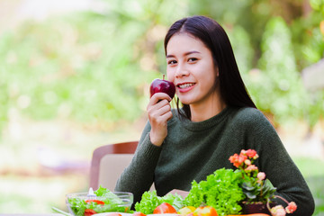 Asian beautiful young girl eating salad vegetable