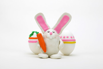 Plasticine rabbit with easter eggs.