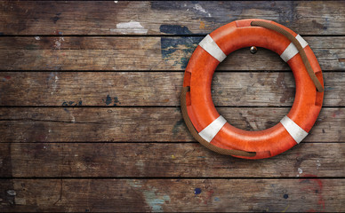 Lifebuoy on rough wooden wall. 3d rendering