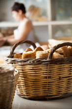 Basket With Bread And Woman Baker