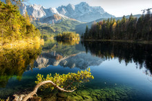 Incredible Autumn Landscape The Eibsee Lake In Front Of The Zugspitze Under Sunlight. Amazing Sunny Day On The Mountain Lake. Top Place For Photography. Eibsee Lake In Bavaria, Germany