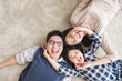 © Nattakorn - Happy Asian family laying with happy and smile, top view