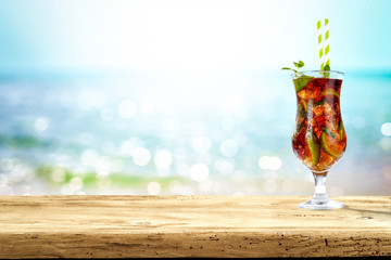 Summer drink on desk and sea landscape 