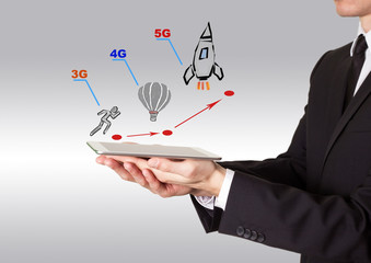 Wall Mural - 5g network tehnology concept. man holding a tablet computer