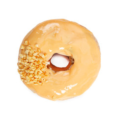 Wall Mural - Donut with caramel icing and nuts isolated on white