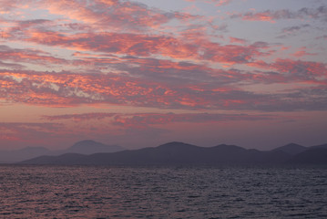 Wall Mural - blue sky with red clouds. sea nature sunrise concept