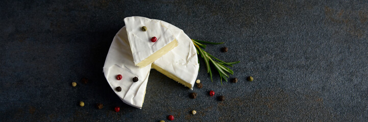 Cheese camembert or brie with fresh rosemary