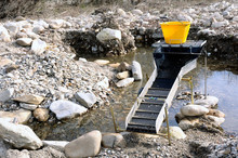 Sluice Or Washing Ramp In Situation In The Water To Search For Gold In The River